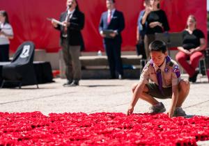 boy laying wreath memorial day 2026
