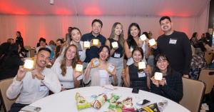 StepStone Hospitality, one of America’s leading hotel management companies, today announced a strategic partnership with Strayboots to deliver immersive team-building, conference engagement, and Corporate Social Responsibility (CSR) experiences across participating properties throughout its portfolio Corporate team members smiling and holding SolarBuddy solar lights during a Strayboots CSR team-building event.