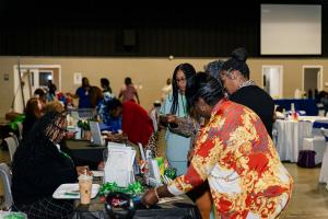 Attendees visiting vendor tables.