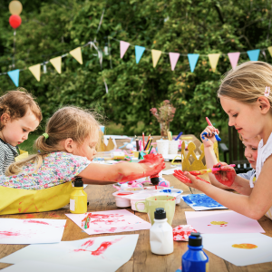 children painting outdoors, outdoor activity, kids painting together, creative kids workshops, children's workshops.