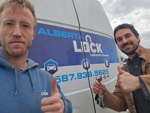Drew MacIVER with Ben Amdii beside Alberta Lock's branded van