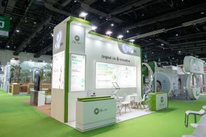 OLI (Original Liv Innovative) exhibition booth at in-cosmetic Asia showcasing CELLPOLYPID innovative technology with green and white bio-scientific design theme and product line displays