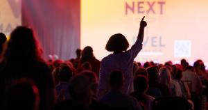 Woman at Next Level Convention expressing her faith