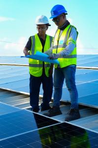 Solaren Renewable Energy Solutions Corp Solaren Renewable Energy Solutions Corp. engineers inspecting solar monitoring equipment, electrical meters, and premium commercial solar components at a project site in the Philippines.