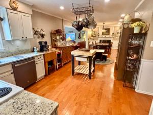 4 BR/2.5 BA home on 1.73± acres in Culpeper County, VA. This home measures 4,423± sf. and features kitchen (all appliances convey); great room w/vaulted ceilings & deck access; living room; dining room w/gas fireplace; office; attic; partially finished walk-out basement