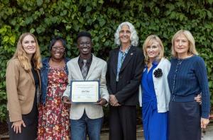 Scholarship recipient Kaleb N., accompanied by his mother, receives the Los Angeles Superior Court Judges Scholarship. Joining the presentation are Hon. Alexis Salzman, Hon. Laura Laesecke, Hon. Debra Cole, and Hon. Lori Behar.