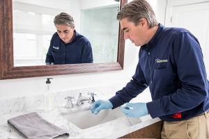 Man looking at sink