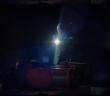 Man searches a darkened warehouse for clues about a missing girl