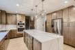 D&G Construction's Denver Kitchen Remodel Centers on a Wall-to-Wall Quartzite Slab and Waterfall Island
