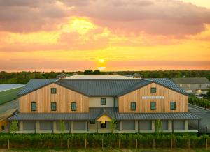 The front facing view of a new storage facility on Nantucket Island during sunset.