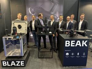 Alpine Eagle CEO Jan-Hendrik Boelens (left) and Origin Robotics CEO Agris Kipurs shake hands after signing a Memorandum of Understanding at Eurosatory 2026 in Paris.