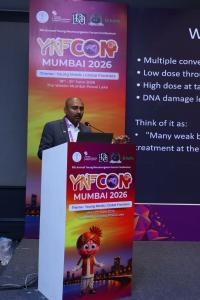 Dr. Mohana Rao Patibandla delivering an invited lecture on stereotactic radiosurgery at YNFCON 2026 Mumbai, discussing the principles and applications of precision minimally invasive neurosurgery.