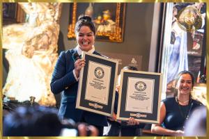 Guinness World Records Adjudicator Amelis Escalante and Jessica Santos display the official record certificates for Michelangelo's Pure Silver David at Museo Michelangelo, recognized as the Largest Pure Silver Sculpture (Supported) and Heaviest Pure Silver Sculpture.