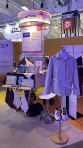 Holon Bionics booth at VivaTech 2026 displaying a prototype jacket, footwear, bags, and pure mycelium material samples developed by Heri Farm's Inc.