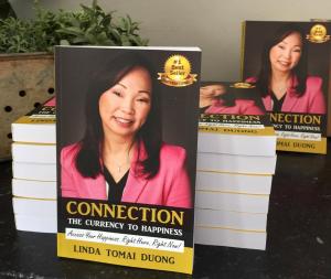 Copies of Connection - The Currency to Happiness book by Dr. Linda. Photo: Dr. Linda Duong.