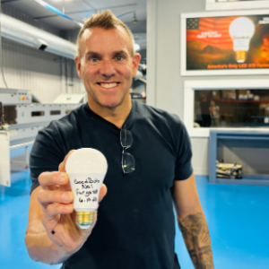 Tom Enright with the first bulb made in the factory