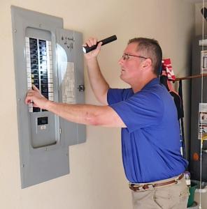 Home Inspector inspecting electrical panel