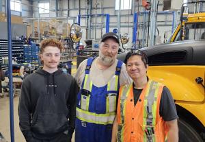CMVTC Expands Canadian School Bus Safety Technology Deployment with Cape Breton-Victoria Regional Centre for Education (CBVRCE) CBVRCE's installers Kyle and John, with Darryl, CMVTCs Lead FST