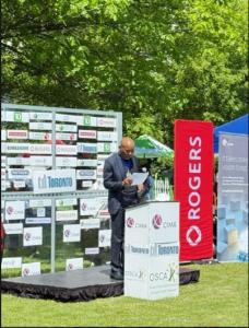 Alfred Ramosedi, incoming CIMA Global President, speaking at a podium during the 2026 CIMA Mayor’s Trophy at Sunnybrook Park in Toronto.