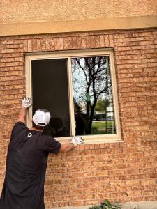 This is an image of an Elite Windows replacing a window on a home to improve energy efficiency and comfort.