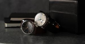 MONOGRIIS RESTA, a Japanese-made 36mm mechanical watch with an ivory dial, blue hands, brown leather strap, and presentation box.