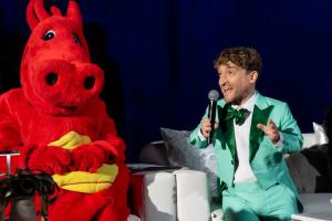 There were plenty of moments that had the room cheering inside Manhattan Beach Studios at the LuskinOIC Innovation + Access Gala LuskinOIC mascot, Ozzie The Dragon and Innovation + Access Gala Emcee, Nic Novicki chat on stage