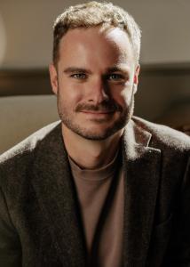 Professional portrait of Kiernan Zilletti, Principal Broker and Owner of Sycamore Realty, a Richmond-area brokerage partner of Jsquared Interior Staging & Design.