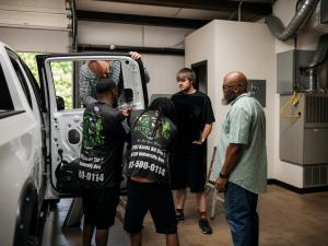 Auto Glass Genie technicians replacing a windshield in Little Rock.