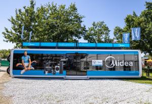 Pulse Tranzformer ground level expandable trailer branded for Midea European roadshow | The Clear Idea