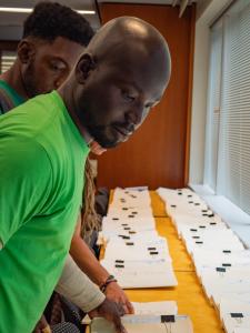 Oye Owolewa helping submit signatures.
