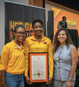 Dr. Kiki Baker Barnes accepts an official proclamation from the New Orleans City Council during the inaugural Her Game, Her Future Fest at LSU New Orleans.