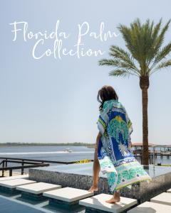 model wearing BAYE London Florida Palm swimwear coverup