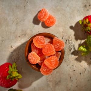 a pile of bright red orange gummies
