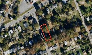 Total Rehab Project Due to Fire Damage: 4 BR/1.5 BA two-story home w/basement on large .25± acre corner city lot • This home measures 1,576± gross sf. and features an eat-in kitchen, living room, dining room, attic, unfinished basement