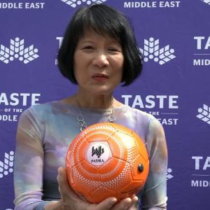 Honourable Toronto Mayor Olivia Chow holding Padra's branded football at the Taste of the Middle East