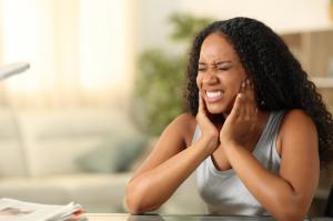 black woman with jaw pain