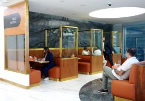 Patients are seated in the dedicated male waiting area at a Padra clinic.