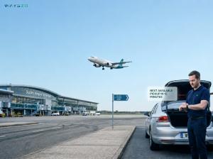Wayszo airport taxi driver waiting near Dublin Airport terminal for passenger pickup