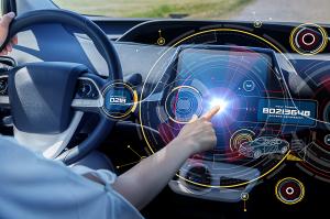 SGS, the world’s leading testing, inspection and certification company, is pleased to announce that its Pune Chakan laboratory has been approved to provide testing services under Trusted Information Security Assessment Exchange (TISAX®) A driver's hand touches a futuristic digital dashboard display in a car, with holographic-style graphics showing security features including a one-time password and access permission codes.