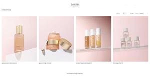 Four Dailish Golden Prestige Collection Korean skincare products on a pink background