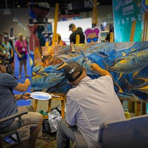 Derek Redwine and Dennis Friel paint a large tuna live at ICAST show