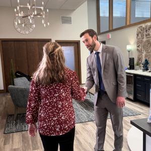 Attorney Evan Tenebruso greeting a new client.