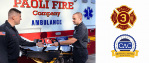 The Paoli Fire Company proudly announces the renewal of its Certified Autism Center™ (CAC) designation, awarded by the International Board of Credentialing and Continuing Education Standards (IBCCES) Two Paoli Fire Company paramedics exchanging medical supplies in front of an ambulance, with fire and autism center logos beside them.