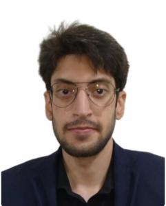 Professional portrait of game producer and level designer Fasi Uddin Mir, whose public journal series document collaborative game production, Agile practices, and reflective marketing case studies to support learning within the game development community.