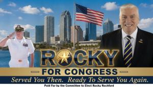 Rocky Rochford for Congress campaign banner showing Rochford in Navy dress whites saluting alongside Rochford in a business suit, Tampa Bay skyline and American flag in background, gold text reading Rocky For Congress, tagline Served You Then Ready To Ser