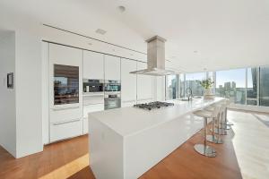 Completed kitchen renovation in Metro Vancouver by 4Local Homes with new cabinets and stone countertops.