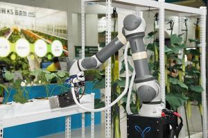 A robot tending plants from an exhibitor in action at AFPRO 2026