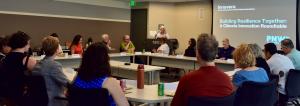 Innovera, a nonprofit focused on advancing climate innovation and community resilience, hosted a session during Pacific Northwest Climate Week, convening leaders from business, government, academia, technology, energy, and the nonprofit sectors for its roundtable discussion, Building Resilience Together Executive Director Libba Pinchot addresses participants during Innovera's Roundtable at PNW Climate Week