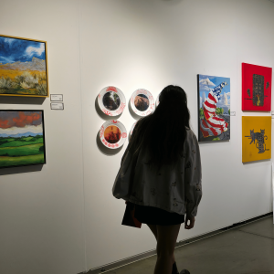 visitor-exploring-contemporary-art-exhibition-wall.jpg