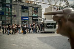 Nomad Luxe mobile pop up shop branded for Revolut with a queue of visitors at Birmingham Bullring | The Clear Idea